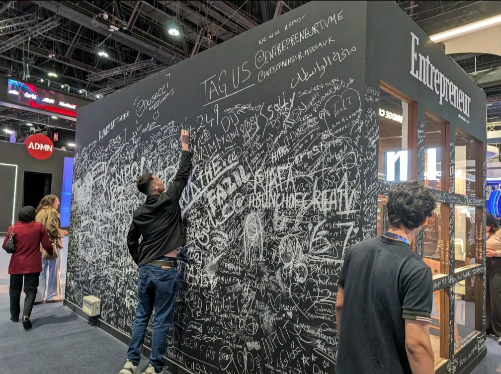 Entrepreneur Middle East blackboard wall with attendee signatures at BRIDGE Summit
